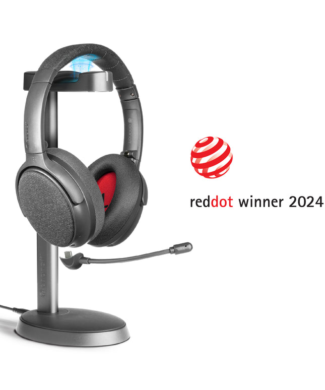 A midnight blue ONANOFF wireless ANC Bluetooth headphones with a detachable boom microphone sits on a stand, set against a clean white background. Winner of the RedDot Award 2024
